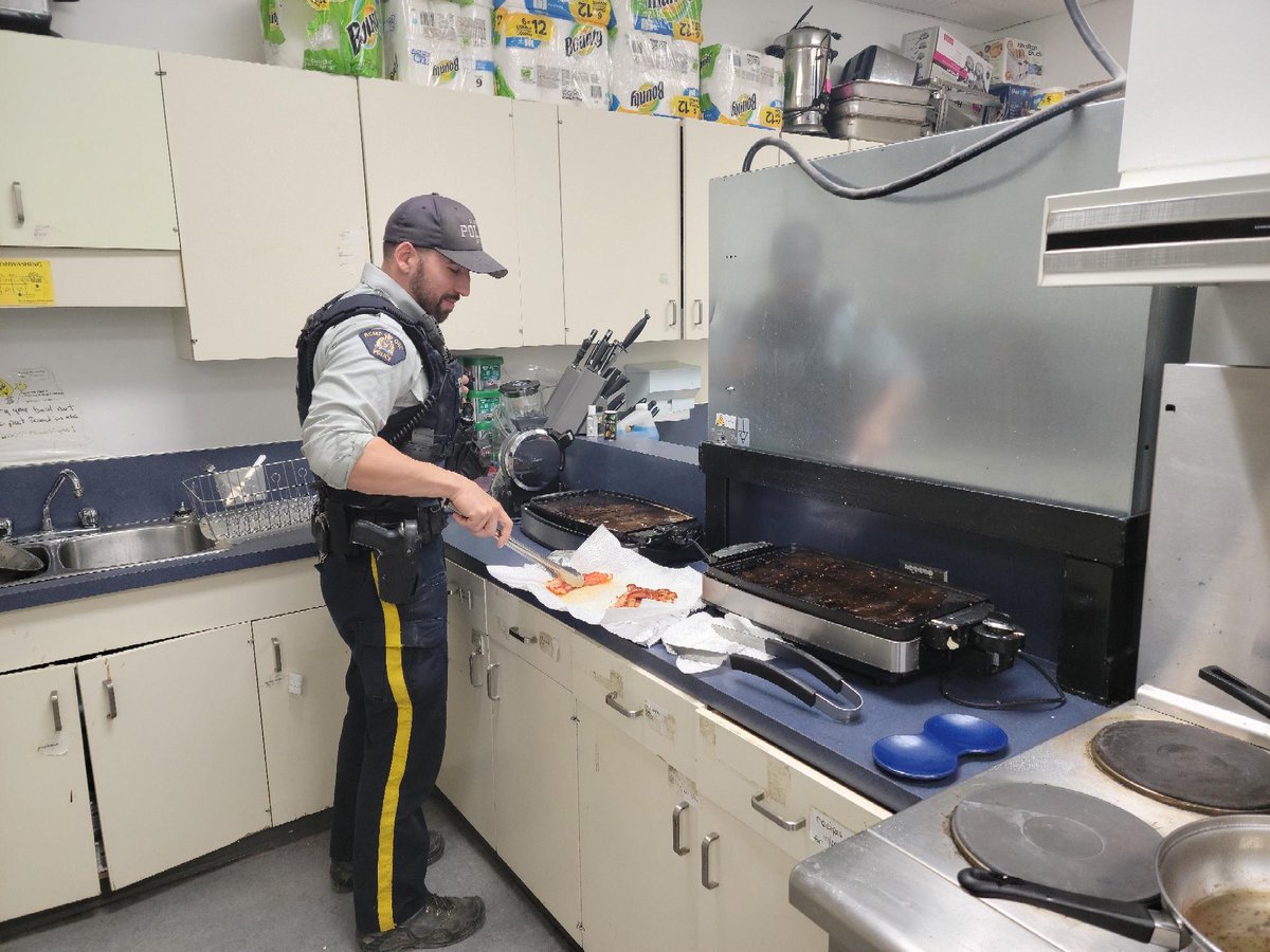 Norman Wells: Cst. Jon Rondeau helping prepare breakfast for the students at Mackenzie Mountain School.