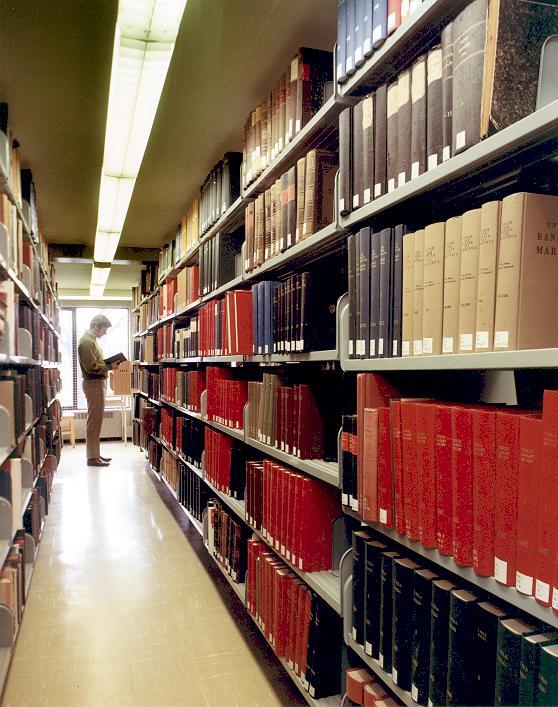 DigitizeUBC's tweet photo. The stacks are a great place to keep warm on a chilly day. UBC Archives Photograph Collection: https://t.co/nOTUSUB7aT @ubclibrary @UBCArchives #UBClibrary #librarystacks https://t.co/9L38n9Gijg
