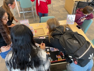 ReadAcrossRISD's tweet photo. The students at RECHS are loving the library puzzle station. In just one week they have completed two-1000 piece puzzles! #RISDlibraries #puzzlemasters #brainbreak https://t.co/h8WwPLsP0S