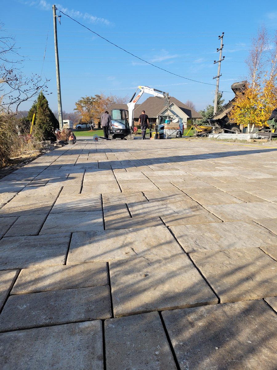 Loving this beautiful November weather! Laying pavers in a t-shirt at this time of year isn't too hard to take