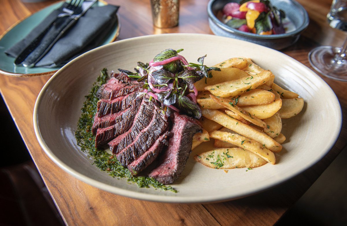 Hangar steak frites is a comforting classic. 

Seared hangar steak is paired with an herbaceous salsa verde, bright malt vinegar aioli, and hearty steak fries.
