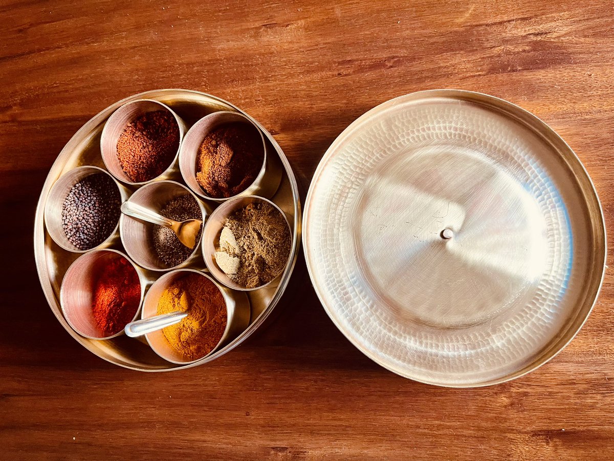 ShefVaidya's tweet photo. I love the beauty of handmade things. This hand-beaten brass masala dabba is a local #madeinpune product hand-crafted in तांबट आळी. Love the burnished glow that sets off the vivid colour of the spices. https://t.co/zGeK5LHUgG