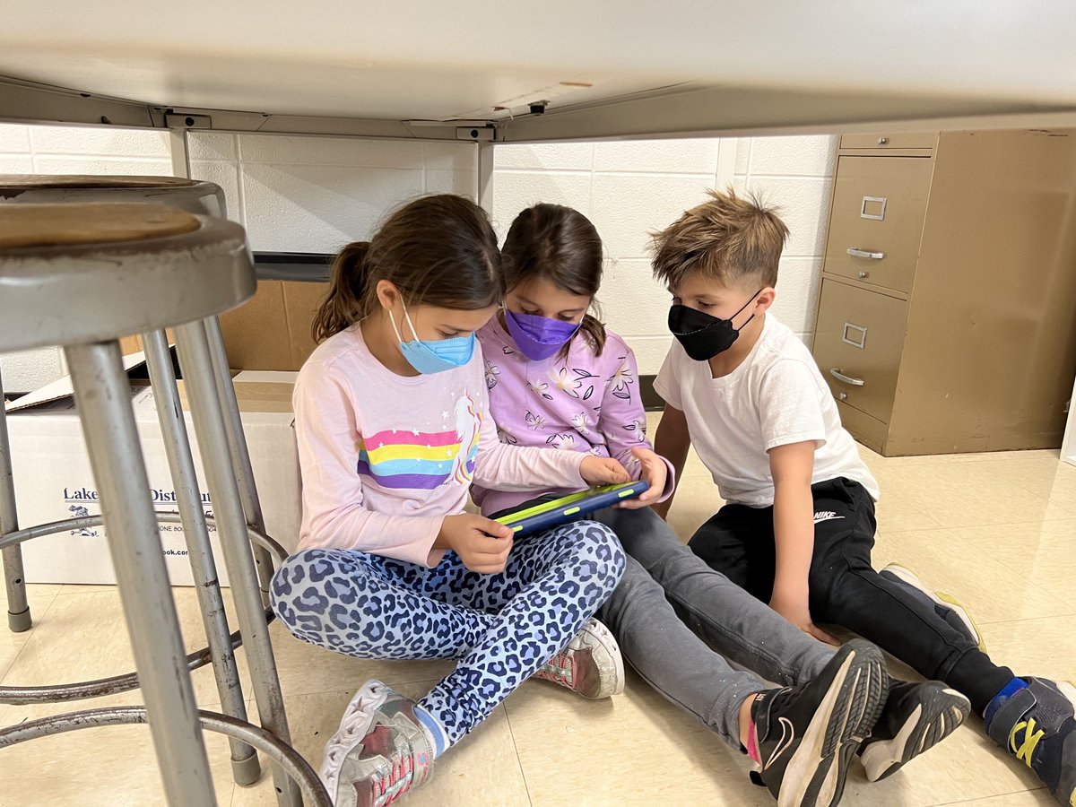 Steph_Sukow's tweet photo. The littlest coaches were reading up on the critiques from this past week’s tournament. #cgspeech https://t.co/tmkW8EPeO4