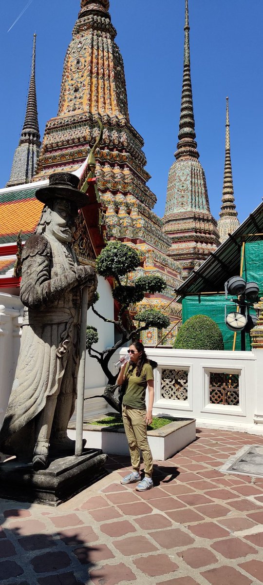 Netty's tweet photo. Keeping hydrated and learning about Thai culture in Bangkok, at Wat Pho temple. Getting ready for IPPA! #IPPA22 #HEASontour @HeasVienna https://t.co/ju6SC3bxIX