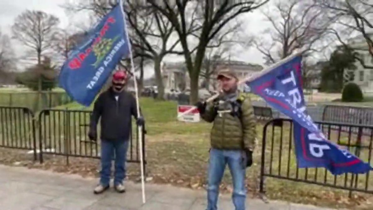 rocketman2001's tweet photo. Let's #SeditionUnmask this guy. Companion of #LittleManSprayer, #FBI286, who calls him brother. Black face mask with "China Lies," Red MAGA cap, black hooded jacket, black gloves, blue jeans, large blue flag on long white pole. 
https://t.co/U9r96w2C8n
 16:53 https://t.co/LfRqINFrCX