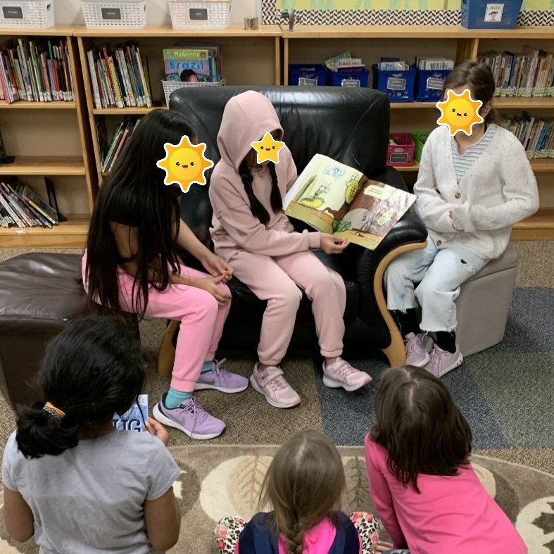bw_RETSD's tweet image. Grade 5 students from Ms. Hando&apos;s class have been helping with some important library jobs but today they wanted to read to the grade 1/2 class that was in the library. Ms. Chorney&apos;s students loved this! @RETSDschools