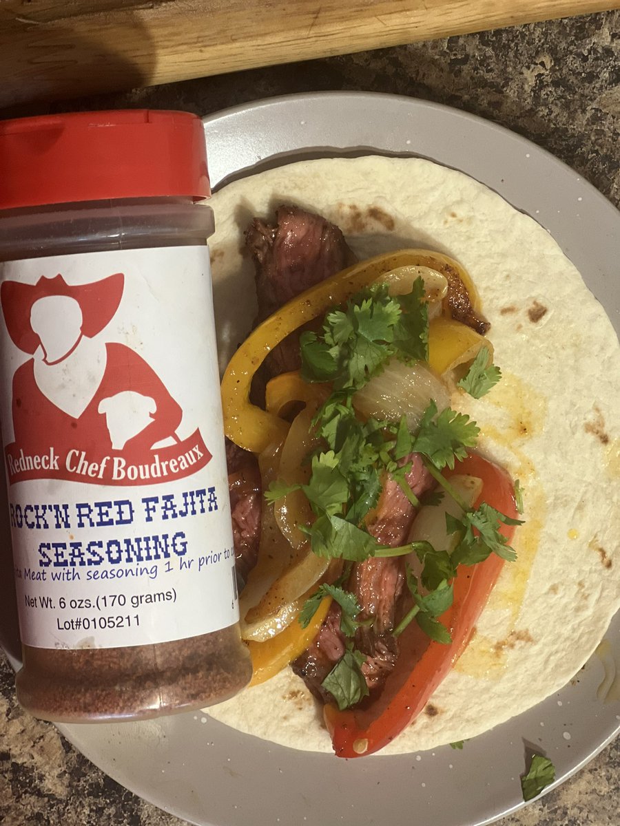 The_DudeNetwork's tweet photo. Skirt steak fajitas, onions, peppers, cilantro. It only made sense to use @RedneckBoudreau ‘s Rockin Red Fajita seasoning. It’s a solid solid choice!! https://t.co/pDubTZf5AD