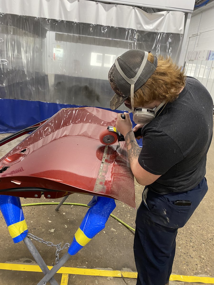 One of our body technicians, sanding in preparation for paint.