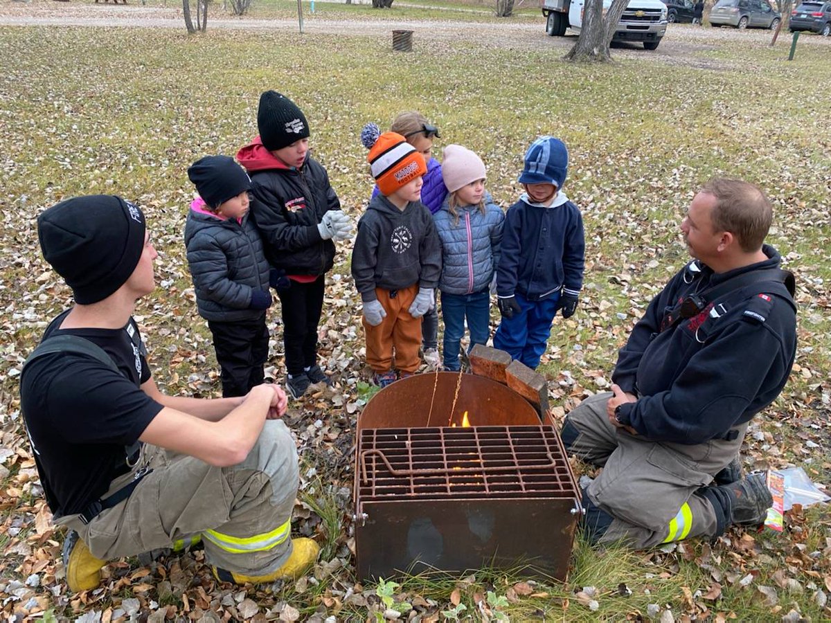 CBFireRescue's tweet photo. On Wednesday, firefighters Deyneka and Fraser visited the Bush Kids group at the campgrounds, speaking to them about campfire safety. https://t.co/xurRli1RGd