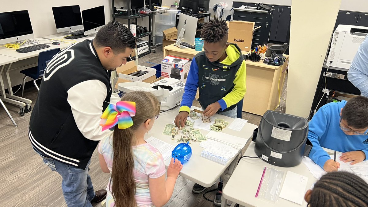 Students at Forest Lane Academy make bank deposits into their accounts during our monthly Jaguar Piggy Bank Day! Thanks UTB for partnering with FLA! #FLAleads #risdbelieves