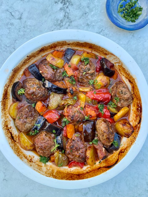 All in one bake Turkish meatballs and vegetables casserole just out of the oven- great one to prep ahead, freezes well too, a delicious weekend or week day treat, recipe from Ozlem's Turkish Table cookery book, hope you enjoy it ozlemsturkishtable.com/2012/07/casser…