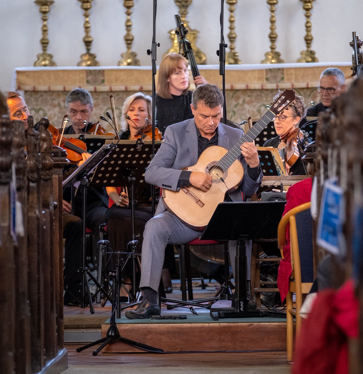 ClassicManagem1's tweet photo. Craig gave the world premiere of  William Lovelady's Guitar Concerto in July for Music in Country Churches in Cley, Norfolk with HM King Charles III (then HRH The Prince of Wales) sitting in the front row! See the London premiere this Sunday! https://t.co/p828ulb5AJ https://t.co/OMMKkkydPq