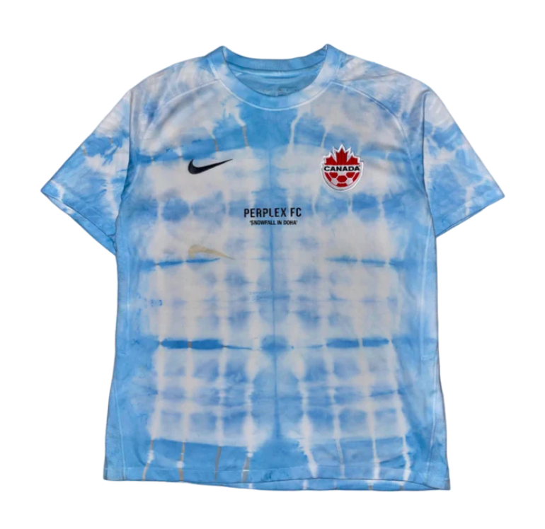OtherFootballCA's tweet photo. New to the List:

Snowfall in Doha, hand-dyed reworks of authentic #CanMNT home jerseys by @PerplexFC.

Get yours => https://t.co/kvPVgaJ6Xb https://t.co/wKIIjKGDHv