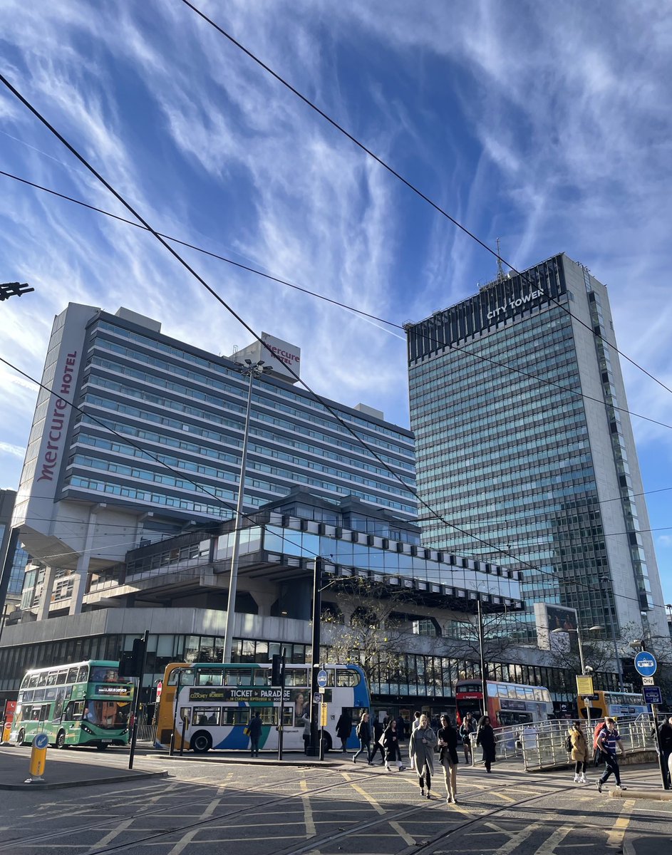 Occasional urban blue amidst often showery streets. Distinctively Mcr
