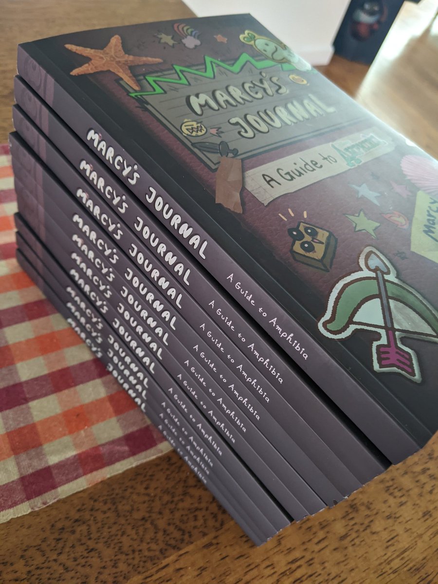 Radrappy's tweet image. MARCY'S JOURNAL IS ALMOST HERE!!! @TOKYOPOP sent me samples of the softcover edition and it turned out better than I could have hoped. Holding a piece of physical media just hits different 😭!! The book comes out Dec 6 - preorder here: tinyurl.com/4rx4tnv7