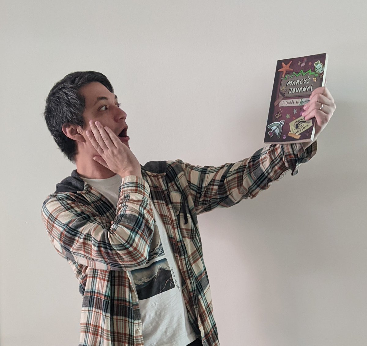 Radrappy's tweet image. MARCY'S JOURNAL IS ALMOST HERE!!! @TOKYOPOP sent me samples of the softcover edition and it turned out better than I could have hoped. Holding a piece of physical media just hits different 😭!! The book comes out Dec 6 - preorder here: tinyurl.com/4rx4tnv7