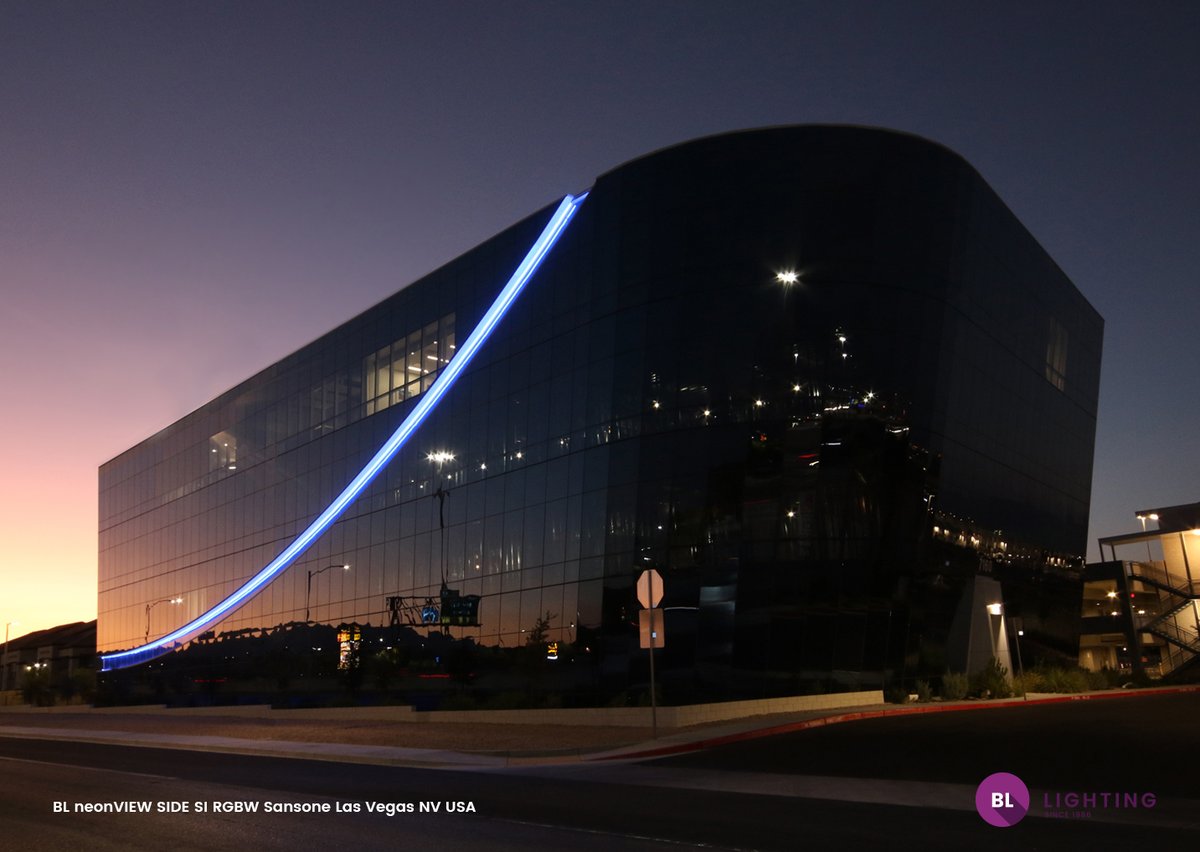 BL_Lighting's tweet photo. New Case Study! Our BL neonVIEW brings a glitzy swoosh of curvy bling to highlight AXIOM’s cool and modern all-glass and steel façade, nestled in the shimmering heat of the Mojave Desert. Find out more about this project here: https://t.co/3RCWDyyWOx  #architecturallighting https://t.co/F2OAEsVE7B