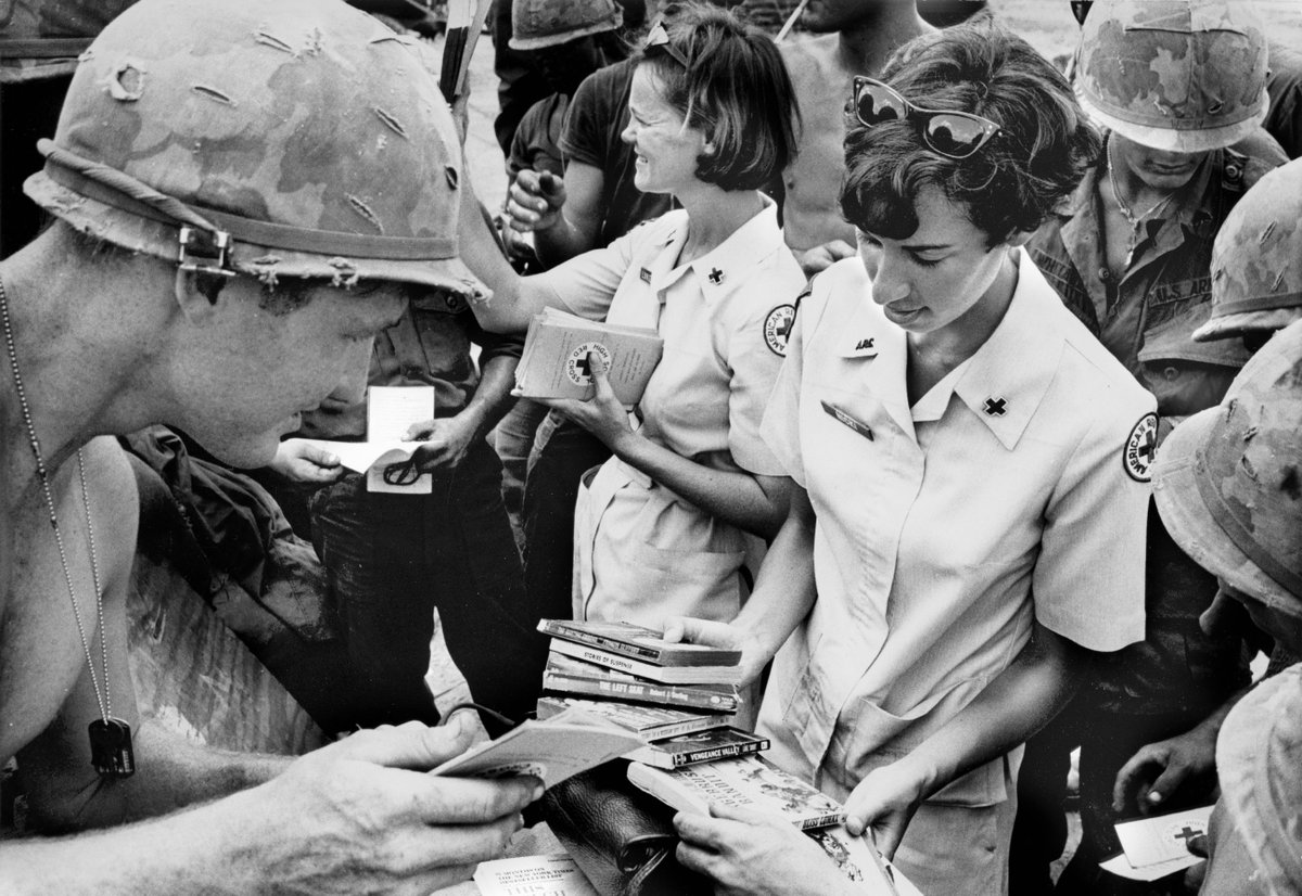 RedCrossNorCal's tweet photo. Veterans Day is next week, but the @RedCross supports our veterans, active military &amp; their families every day, as we've done for over a century. Here, Red Cross volunteers give books to U.S. soldiers in Vietnam, items regularly shipped through the Red Cross for the troops. https://t.co/U5WZxBKVIm