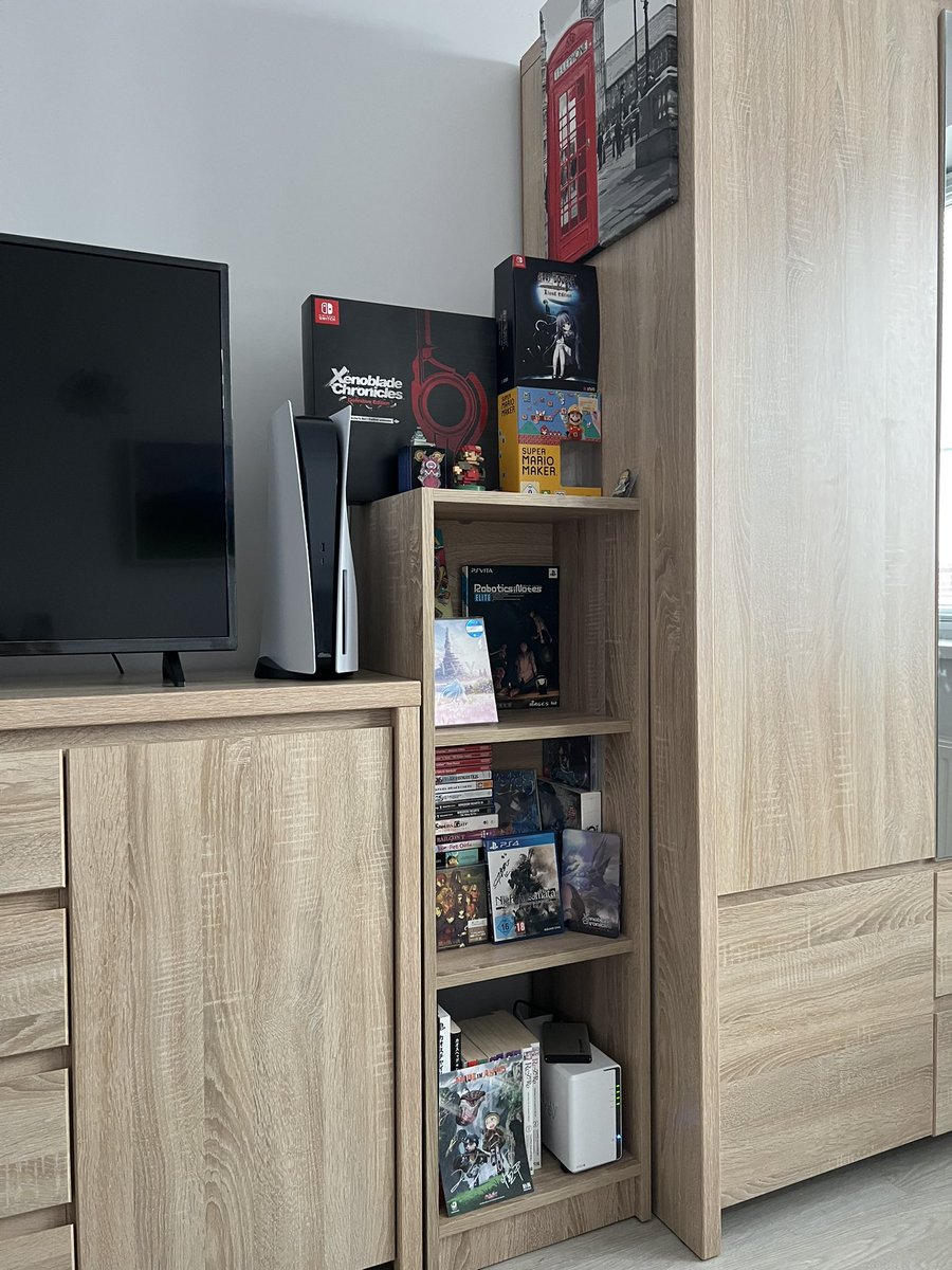 ConclusionNeon's tweet photo. @Rosemi_Lovelock My room is probably pretty boring but I might as well try. Can't change much since it's a rental... Also I really need to fix lack of Nijisanji merch 😅 #RosemiRoomReview https://t.co/09Nxi1inN0