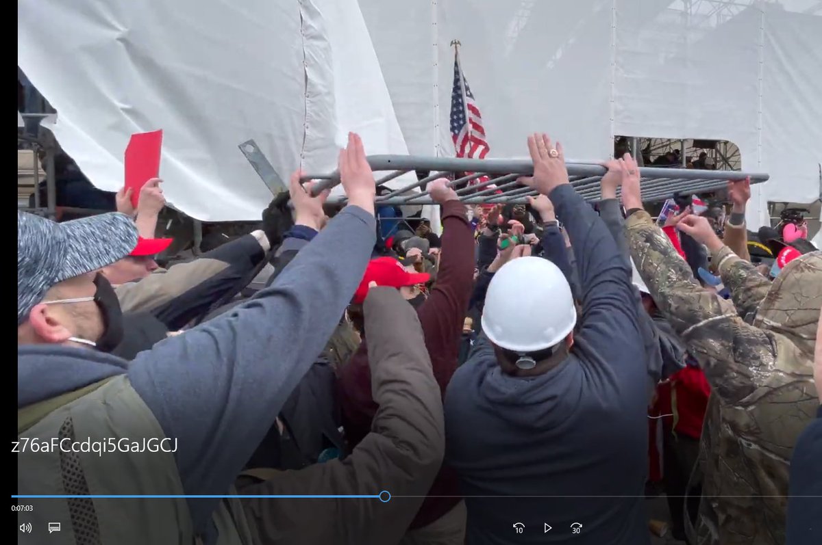 creek_twit's tweet photo. Here is #VibratingHatMan in hyperbole video https://t.co/zLIKIZ846v helping a crowd removal of a bike rack that had been protecting police. 7:03 https://t.co/eiw2EWYT7A
