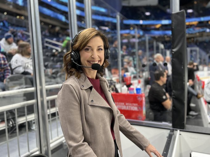 Image of Alison lukan between the benches for tonight’s broadcast