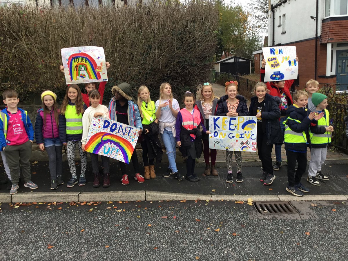 NewlaithesPS's tweet photo. Year 5 are lining the streets with their banners to support Kev #Ultra7in7 https://t.co/TEqeApFtCl