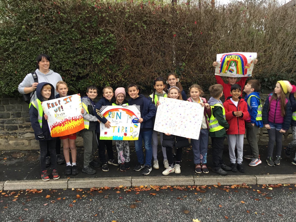 NewlaithesPS's tweet photo. Year 5 are lining the streets with their banners to support Kev #Ultra7in7 https://t.co/TEqeApFtCl