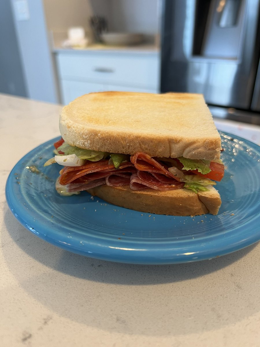 Friday lunch time! Little salami, hot “gabagool”, hot Calabrese, lettuce, onion, tomatoes, salt, pepper, oregano #lunch #friday #weekend