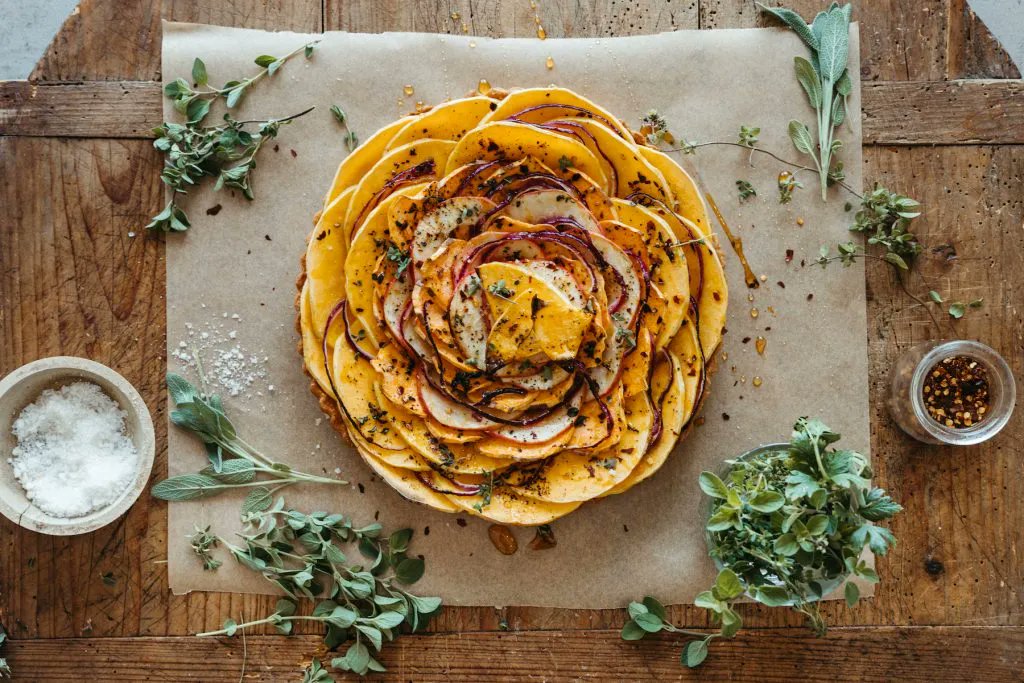 Peace_Cooking's tweet photo. Add this meatless main from Camille Styles to your Thanksgiving menu for your vegetarian guests. A flaky pre-baked pie crust layered with creamy herbed ricotta, then topped with layers of squash, sweet potato &amp; apples ---  Butternut Squash and Ricotta Tart https://t.co/RH2yYZMMhF https://t.co/vDTatffr0E