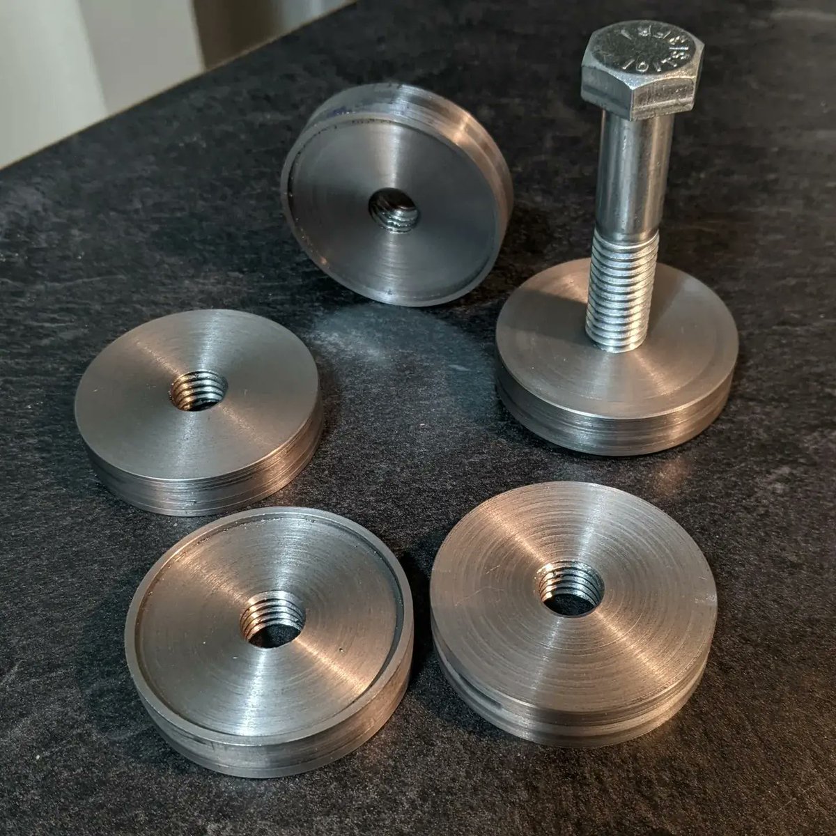 aj_suchocki's tweet photo. I made a set of rubber bottomed steel pads for some leveling feet I'm making. https://t.co/XUhIDm8fDd