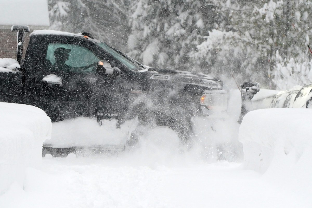 A plow driver makes his way to a customer's home in Orchard Park Friday, November 18, 2022.      (Mark Mulville/Buffalo News) #buffalosnow
