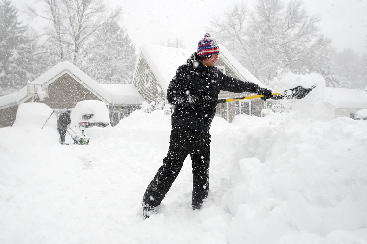 Charlie Benfanti, right, and his father Bill, left, clear the snow from their driveway in Orchard Park Friday, November 18, 2022.      (Mark Mulville/Buffalo News) #buffalosnow
