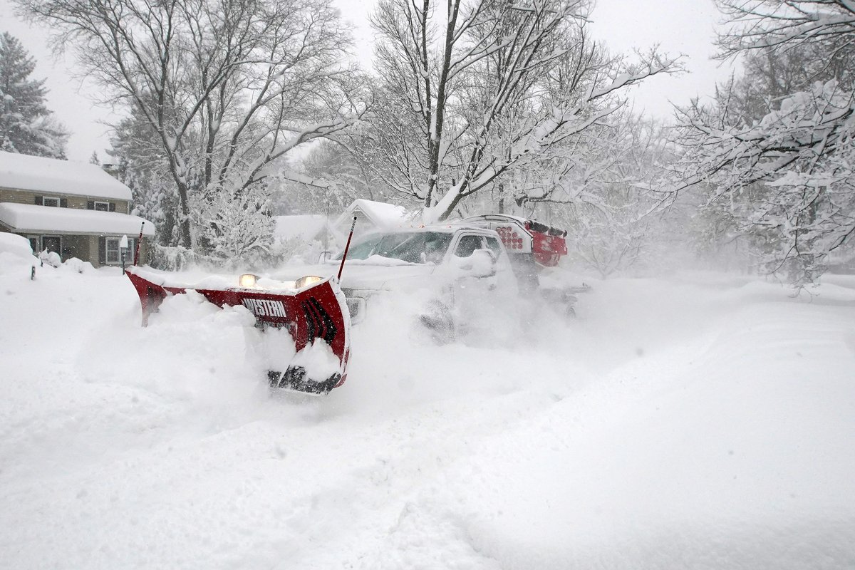 A snow plow truck travels through the snow in Orchard Park Friday, November 18, 2022.      (Mark Mulville/Buffalo News) #buffalosnow