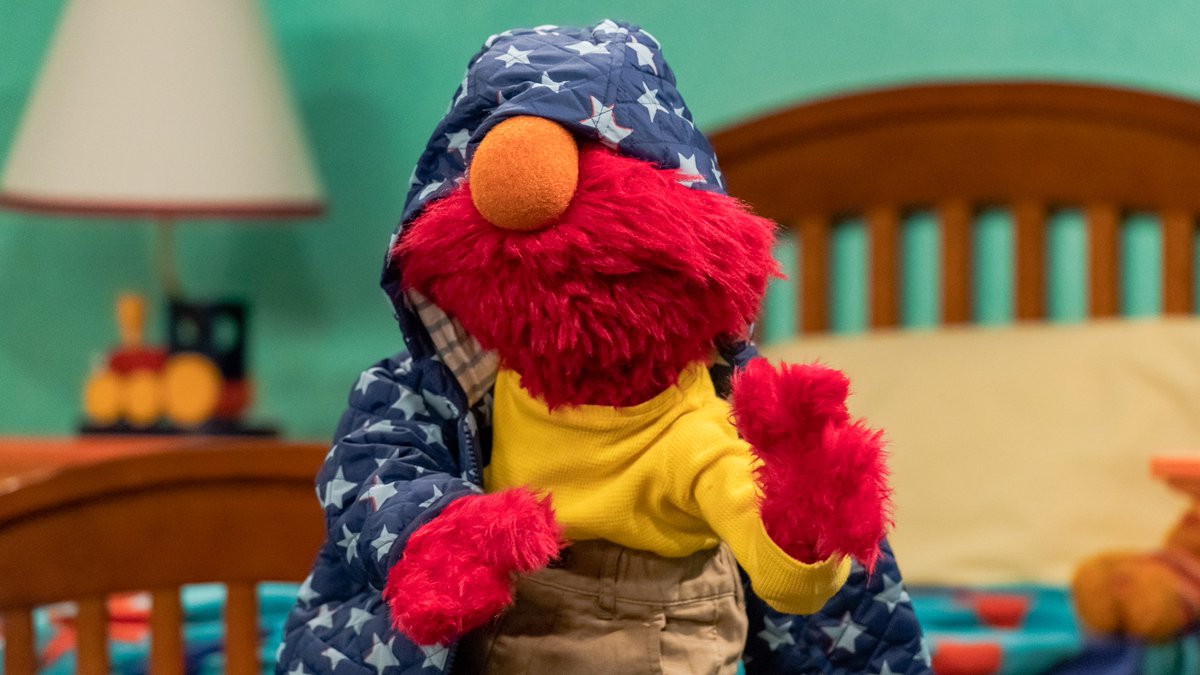 elmo's tweet photo. Can Elmo get a little help here? It's been a little while since Elmo has had to wear a jacket! https://t.co/MeVKihTuvB