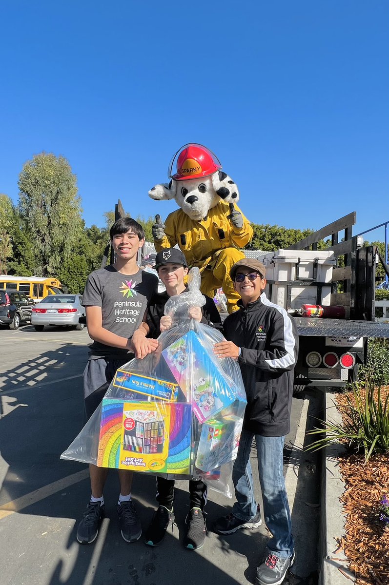 PHS_K8's tweet photo. Firefighters from the Lomita Fire Station #6 visited Peninsula Heritage School to collect toys for the Spark of Love Toy Drive! Students brought in toys all week and were so excited to meet the firefighters and to give back this holiday season. 😄❤️ https://t.co/jhD1oNVxEM