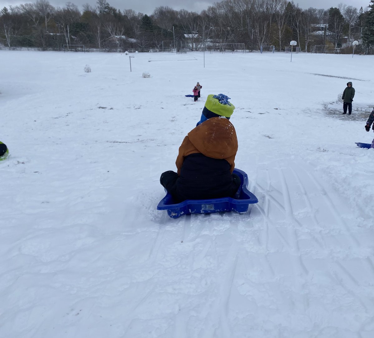 Snow means tobogganing, snow hills,  and making snow forts. Endless amounts of fun.