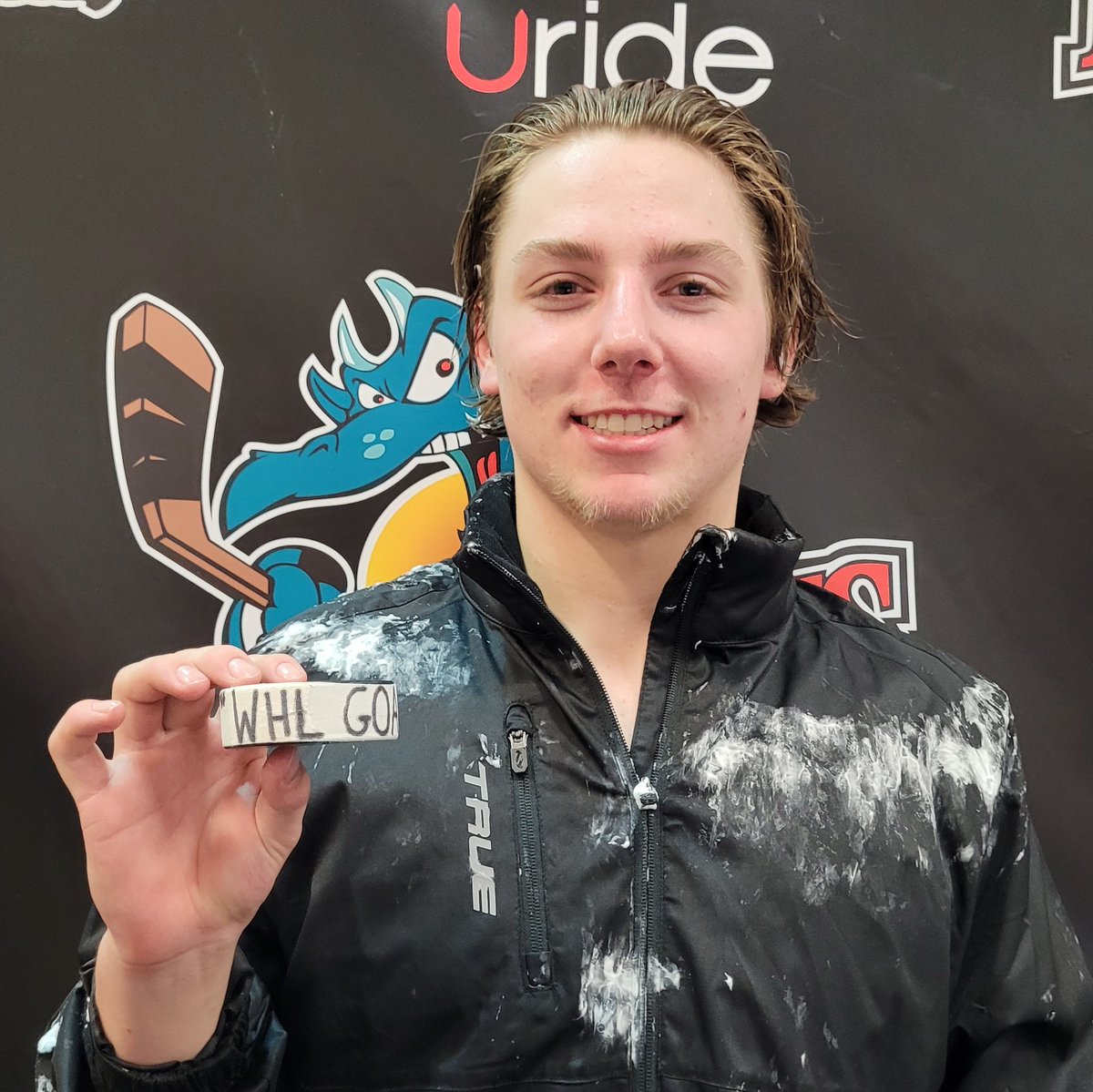 After getting cleaned up from the shaving cream celebration, Grady Lenton was eager to show us his first goal puck.
