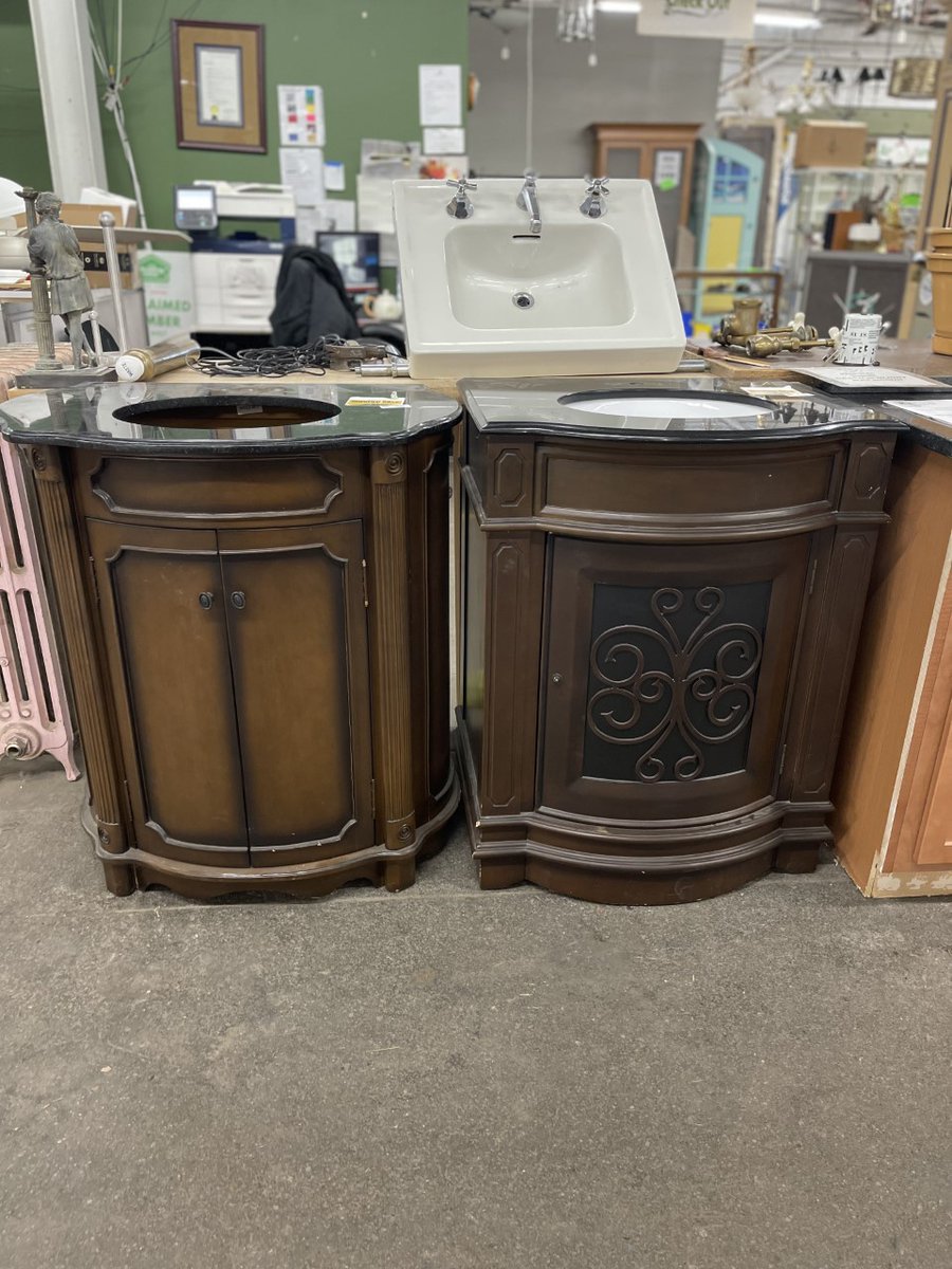 BuildingValue's tweet image. These Abbott vanities have carved scroll details with toffee and walnut finishes. The bow front shape adds style to these classic vanities. A large cabinet provides ample storage. Black granite tops with undermount Kohler sinks. 36" t x 32" w x 21" and 36" t x 28" w x 22" d.