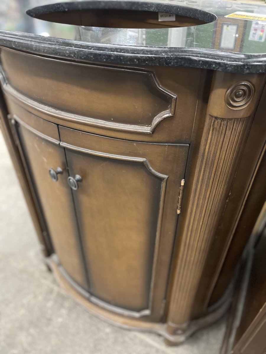 BuildingValue's tweet image. These Abbott vanities have carved scroll details with toffee and walnut finishes. The bow front shape adds style to these classic vanities. A large cabinet provides ample storage. Black granite tops with undermount Kohler sinks. 36" t x 32" w x 21" and 36" t x 28" w x 22" d.