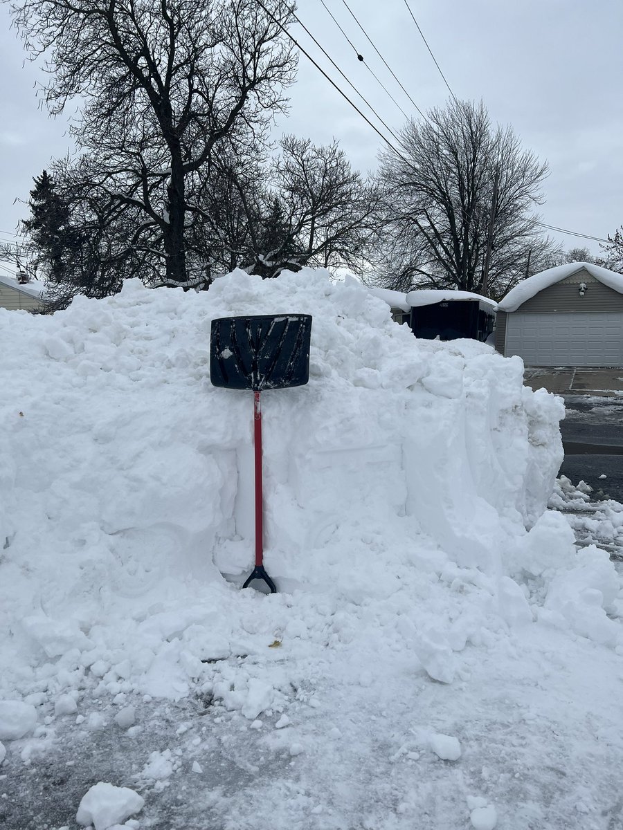 ShutupToshi9227's tweet photo. This shovel is little over 4 feet tall, for scale. Probably got a hair under 5 feet of total snow. 4 hours of shoveling so far. I might be dead. #BuffaloWinter https://t.co/DbzY9PtXnv