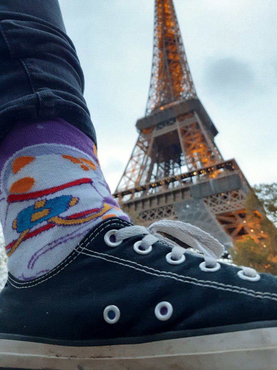 kwidua's tweet photo. Walking around Paris in my new Space Cat Socks I got from @SymfonyCasts at the #SymfonyCon 😻🚀 https://t.co/aXcNFAPULf