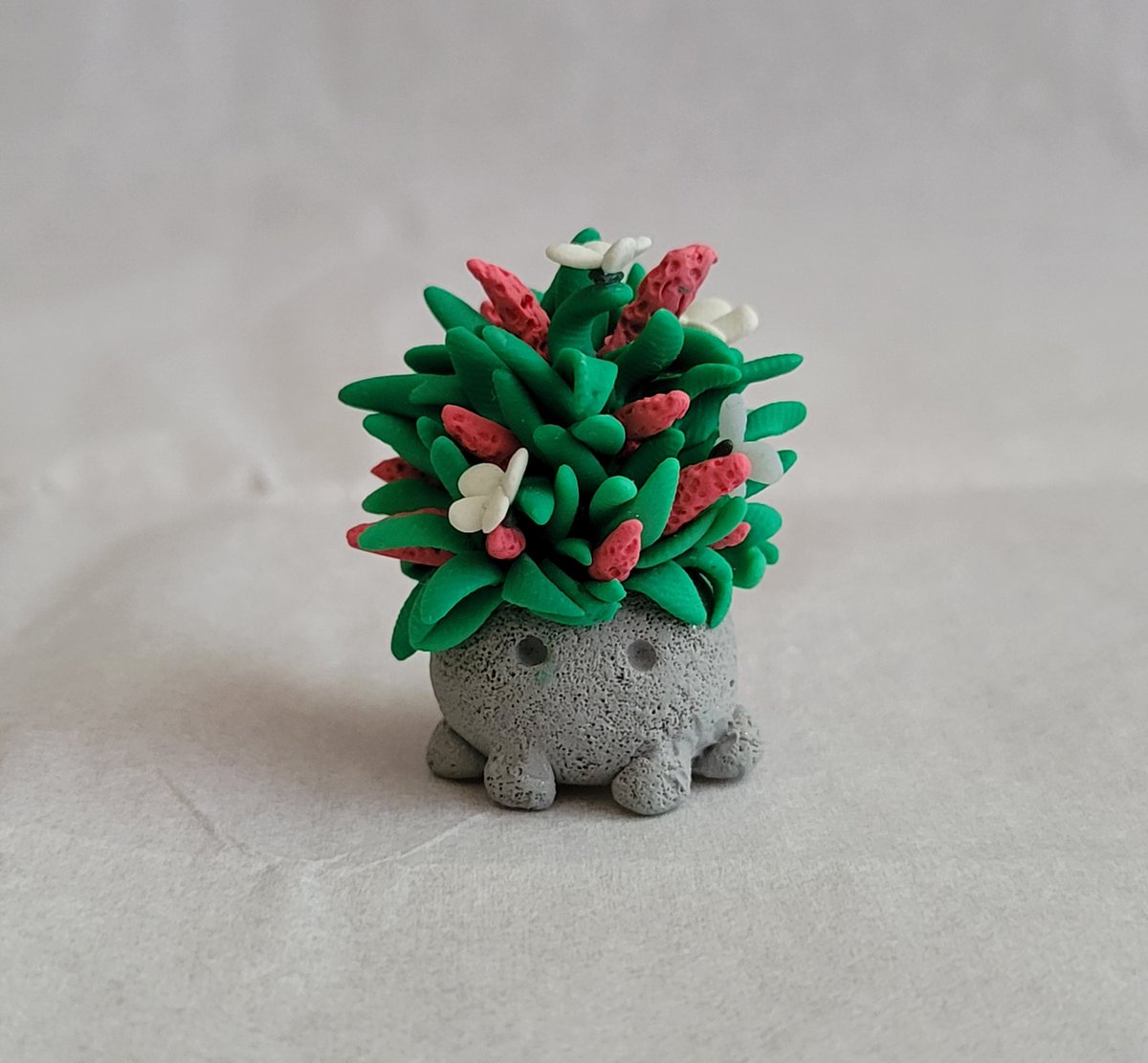 themuseturtle's tweet photo. Decided to finally start posting photos of my Garden Golem polymer clay sculpture series. The first one up is the butterfly bush! https://t.co/Vj1nW1nRgw