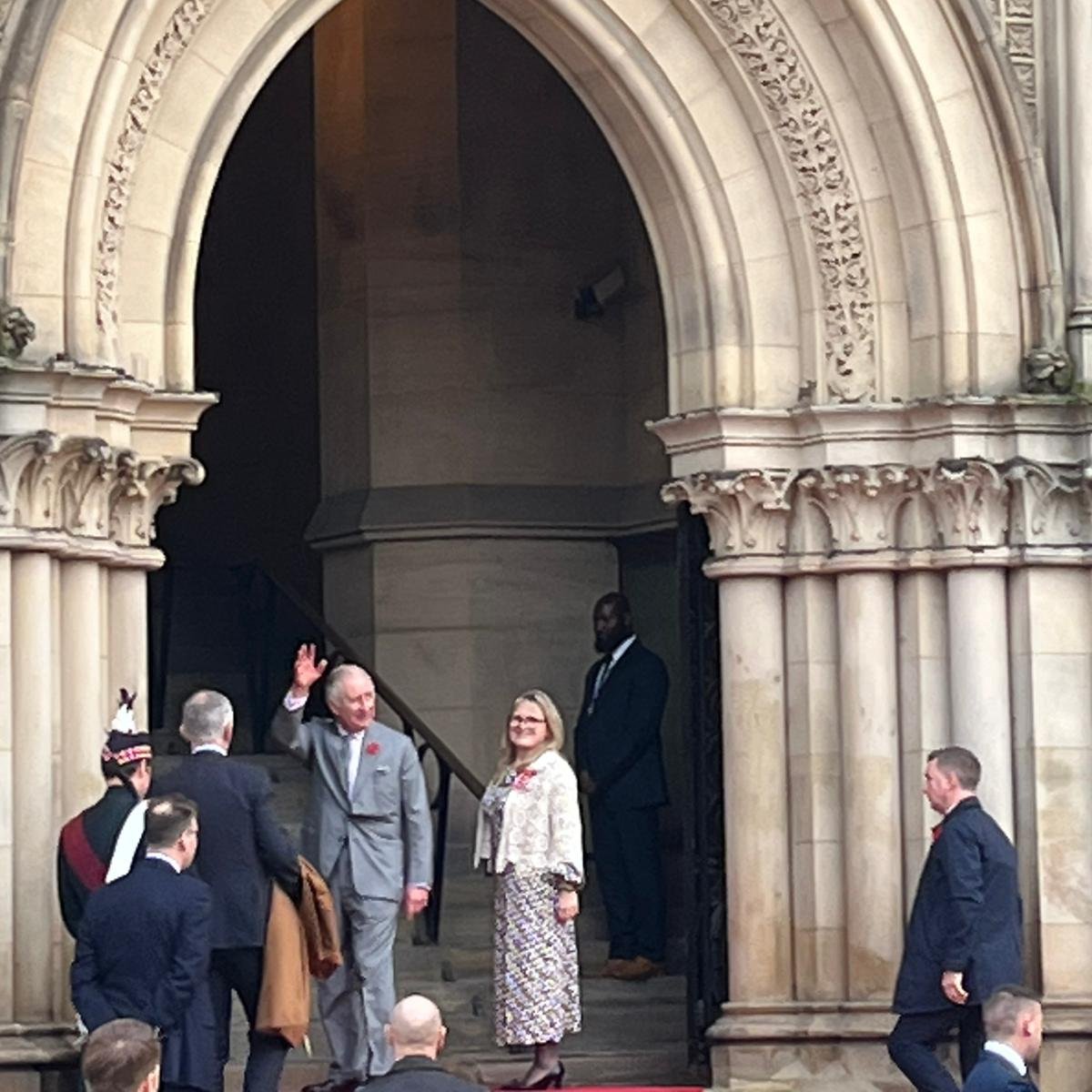 King Charles waves to the crowd