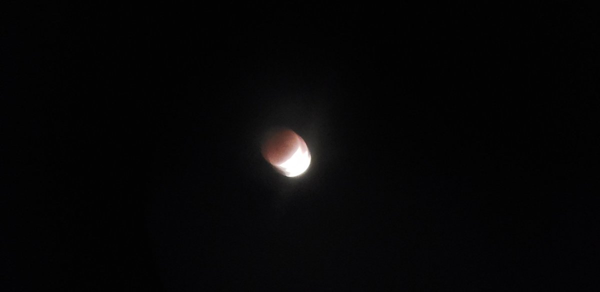 LiveAFullerLife's tweet photo. My photo attempt through binoculars! 5:06am Quincy Ma  #LunarEclipse https://t.co/1UqR2AjRls