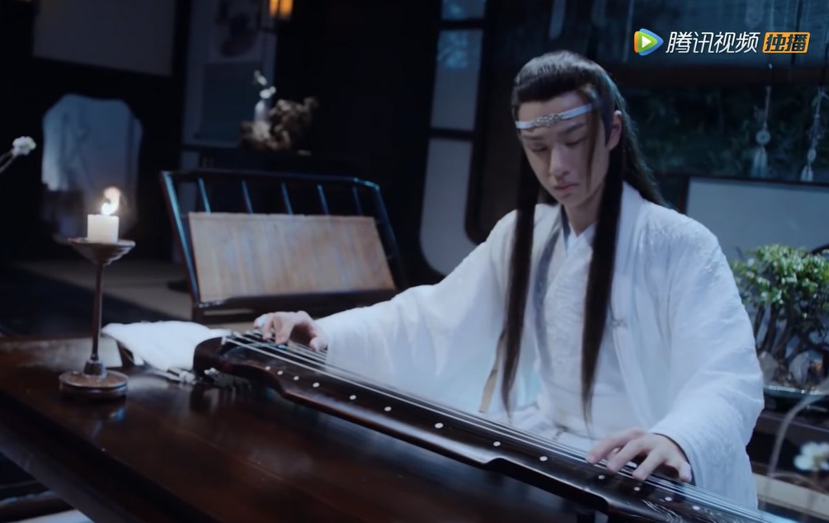 just lan wangji looking pretty while playing the guqin