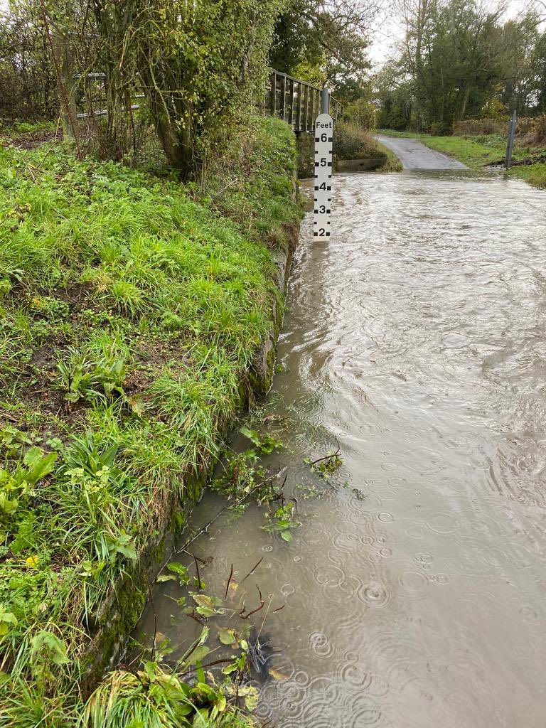 Jlangt's tweet photo. @ShropCouncil To emphasise this is going to end very badly if not dealt with as a matter of urgency. This is today’s situation. A funeral at Westhope had been told it was safe to cross!!! If my wife hadn’t stopped then the cars would have swamped. It’s on you @ShropCouncil https://t.co/Xecc4EKMaM