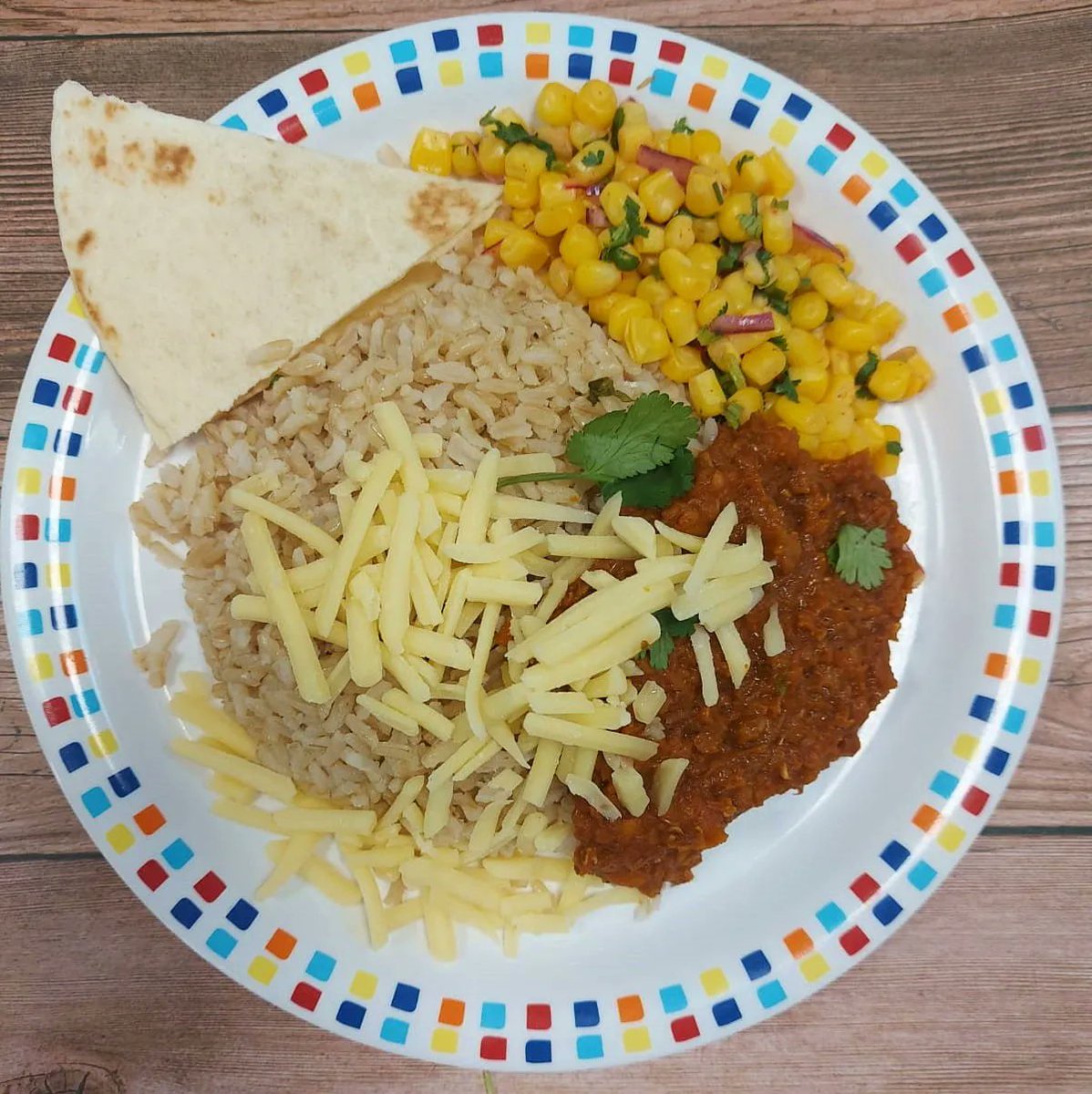 Burrito bowl, with mince, rice, corn, cheese and tortilla for students to explore their plate.

Full menu here: buff.ly/393zCma