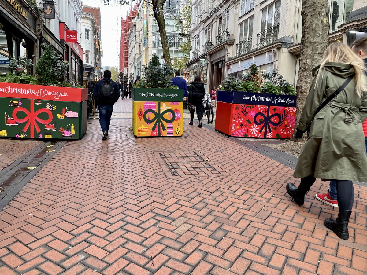 We asked the wonderfully talented and local independent designers ⁦<a href="/pickleillo/">pickleillustration</a>⁩ to come up with a Christmas design for the public realm protection blocks on Lower Temple Street. Wow what a difference!