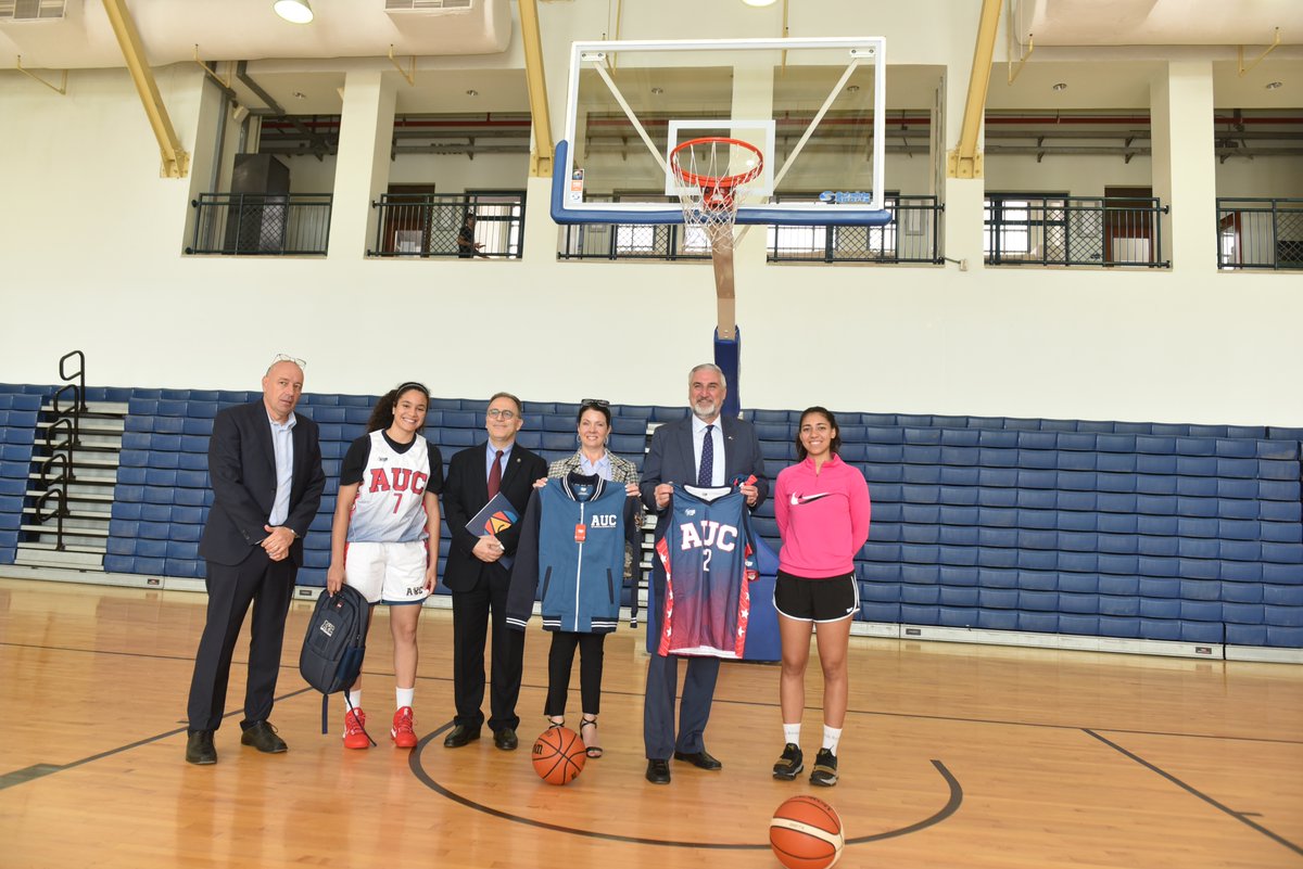 AUCPresident's tweet photo. In keeping with tradition, no visit is complete without @GovHolcomb shooting some hoops, this time @AUC’s ARTOC Basketball Court. #HoosierState #INEgypt #AUCSportsComplex https://t.co/4FeY8PCXx7
