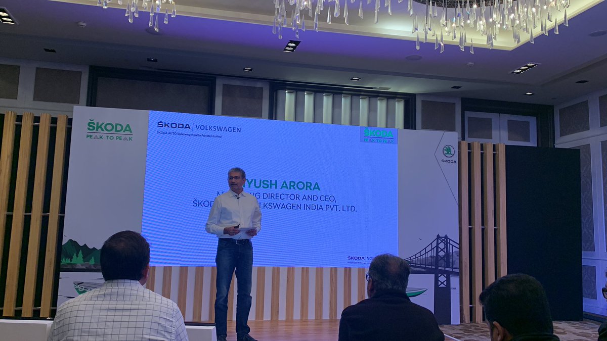 Piyush Arora, MD and CEO, Skoda VW India Pvt ltd on stage talking about how Skoda is driving the success from the VW brand in India